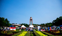The campus green filled with students during a festival