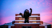 The UAFS Numa Statue in front of the UAFS Stubblefield Center at sunset